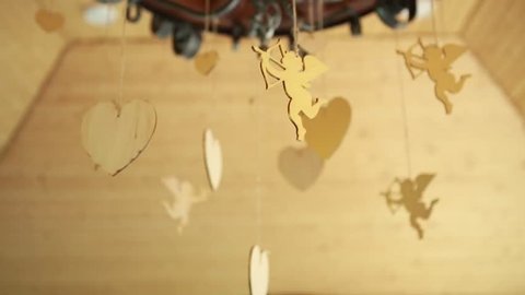 wedding decoration in the form of wooden hearts and Cupid Ukraine