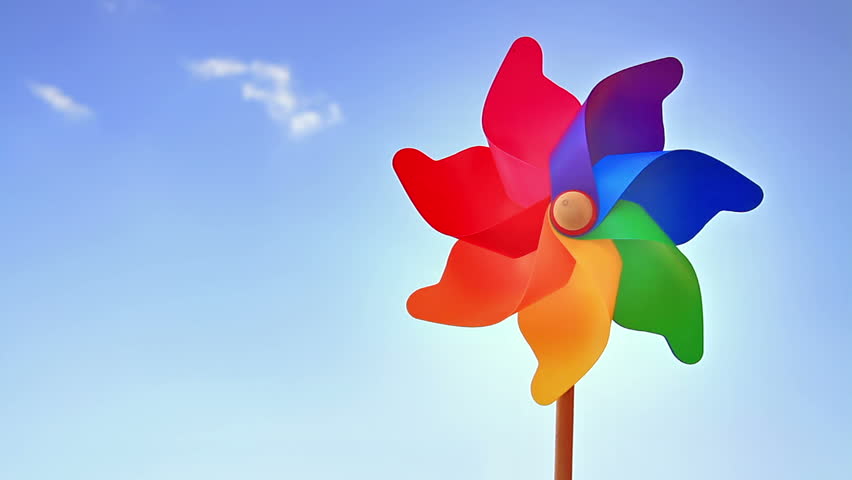 Colorful pinwheel toy against blue sky 