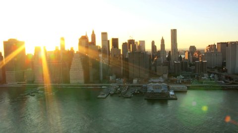 Aerial view of the Setting Sun over Manhattan and the Brooklyn Bridge, New York, North America, USA