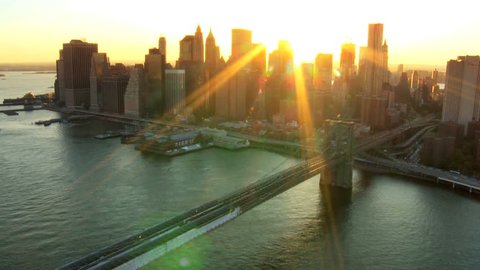 Aerial view of New York Financial District of Manhattan, Brooklyn Bridge and the Hudson River at Sunset, North America, USA