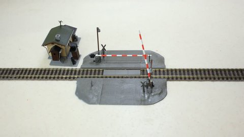 Construction on the railroad crossing, the car crosses it, passing locomotive. Stop motion.