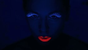 Woman face with fluorescent make up , creative makeup great for nightclubs , Halloween party,  shows and music video 