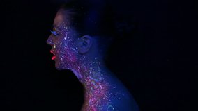 Woman face with fluorescent make up , creative makeup great for nightclubs , Halloween party,  shows and music video 