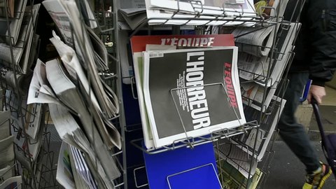 STRASBOURG, FRANCE - 14 NOV, 2015: The front covers of International newspapers display headlining the terrorist attacks yesterday in Paris