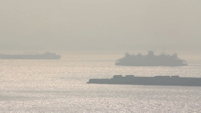 The Staten Island Ferry makes its way across New York Harbor on a foggy morning.