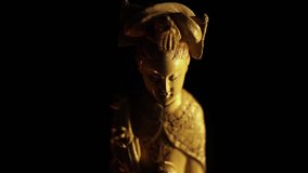 Asian statuette with candle light video