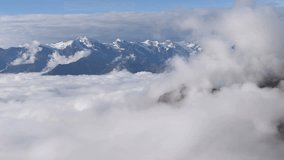 Mheer mountain filmed from Guli pass. Mountains filmed higher than clouds. Upper Svaneti, Mestia near Ushba pass. Georgia, Europe. HD video (High Definition).
