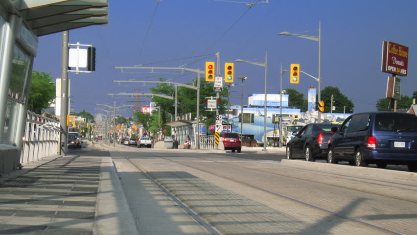 TORONTO - CIRCA JULY 2011: (Timelapse view) Streetcars stopping and going,