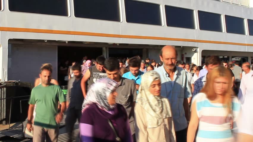 ISTANBUL - JULY 22: Unidentified commuters get off city ferryboat on July 22,