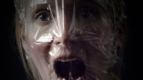 Young Woman Comparing a Panic Attack to Suffocating into a Plastic Bag