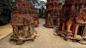Aerial drone video of flight between the towers. Angkor Wat Temple, Cambodia, The World's Largest Religious Building