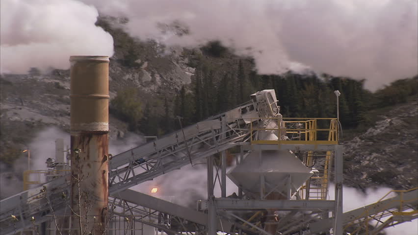 Close up of cement plant smoke stacks
