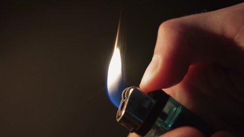 Slow Motion Lighting Lighter in Hand, Flame Flicker - Close Up