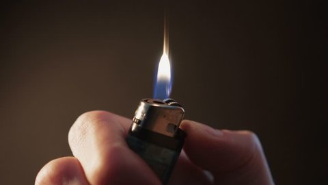 Cigarette Lighter in Hand Flickers & Ignites - Extreme Close Up 2