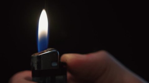 Cigarette Lighter Igniting on Black Background 1