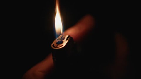 Cigarette Lighter Being Lit in the Dark & Glowing. Close Up, Super Slow Motion 2
