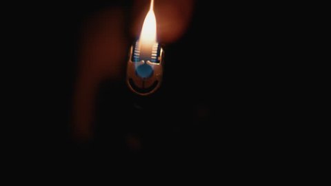 Cigarette Lighter Being Lit in the Dark & Glowing. Close Up, Super Slow Motion 3