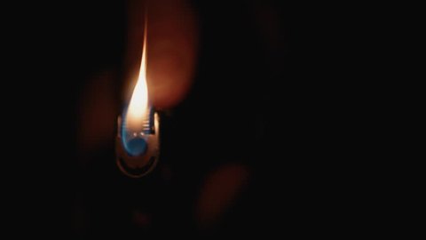 Cigarette Lighter Being Lit in the Dark & Glowing. Close Up, Super Slow Motion