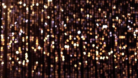 Abstract glittering lights, gold background, a real shot video in the blur Vídeo Stock