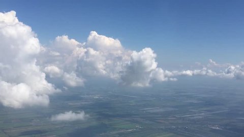 moving clouds seen Through airplane window