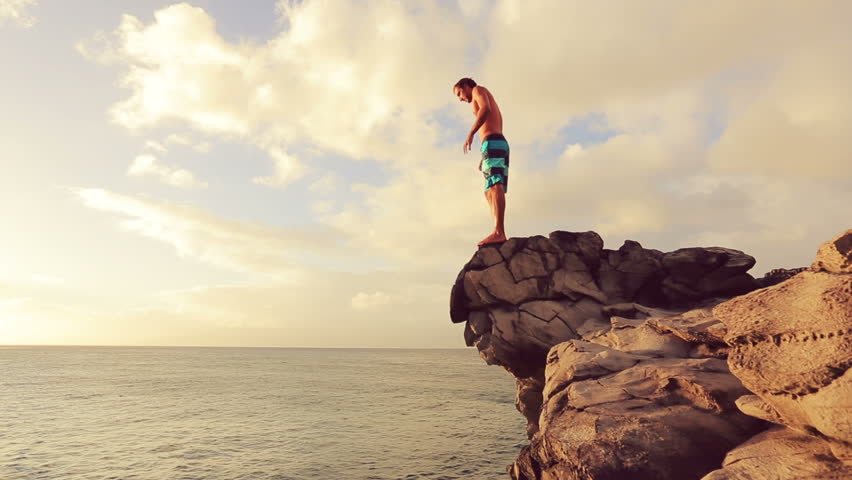 Young Man Jumps Off Cliff Stock Footage Video 100 Royalty Free 12859034 Shutterstock