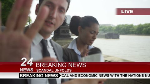4K Couple in business dress in London being bothered by news reporter trying to get an interview. Shot on RED Epic.