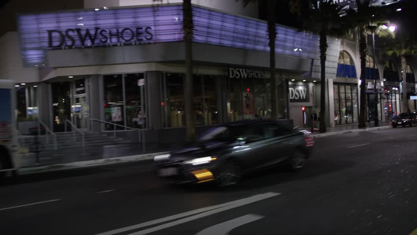 Hollywood: Los Angeles, CA USA Set #45 - Left Front 3/4 View angle: Car travels E on Hollywood Blvd. on a clear evening in light traffic. Shot on RED Dragon.