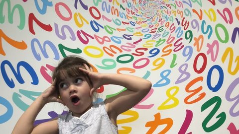 Cute one young little girl (female age 5-6) frustrated with arithmetic problem making faces. Children education concept. Real people. Copy space