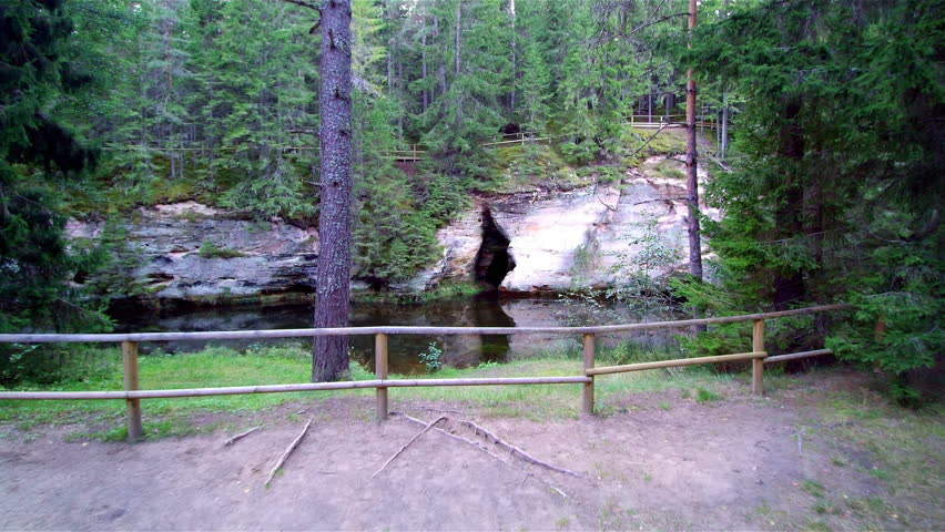 Closer look of the sandstone in the mountain and fronting it is the water from Ahja river in Taevaskoda Estonia