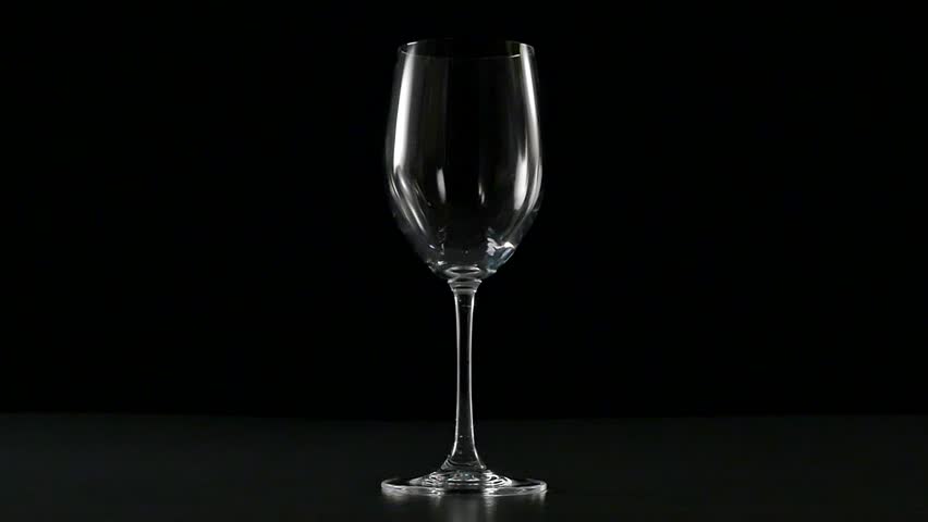 Pouring red wine in a glass