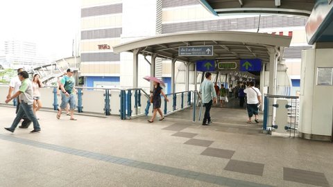 BANGKOK - MARCH 27, 2015: MBK center skyway entrance passage, unidentified citizens walk over, elevated pedway. Catwalk and pedestrian overpass at Patumwan Intersection, Wang Mai, Pathum Wan