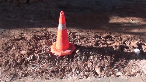 Pylon on dug up road

