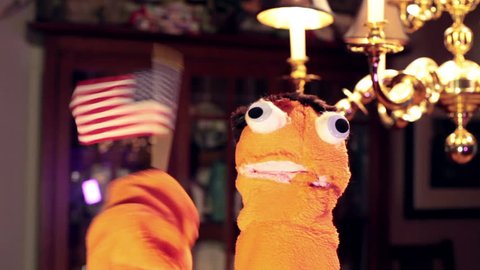 Puppet holding an american flag