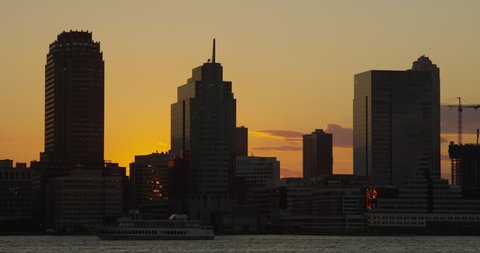 NEW YORK CITY - 5K Time lapse of New Jersey skyline and Hudson river from Battery Park at sunset. Red Epic