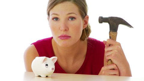 Woman preparing to break into her piggy bank