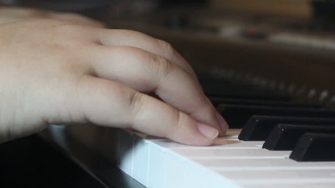 extreme close up hands and piano