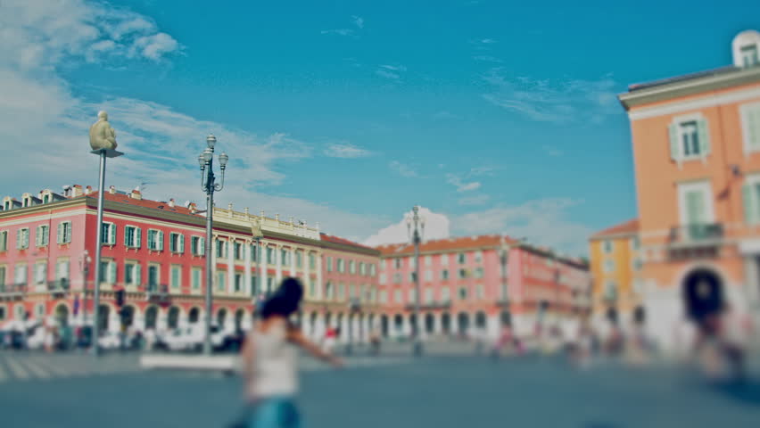 People in a town plaza in a sunny day