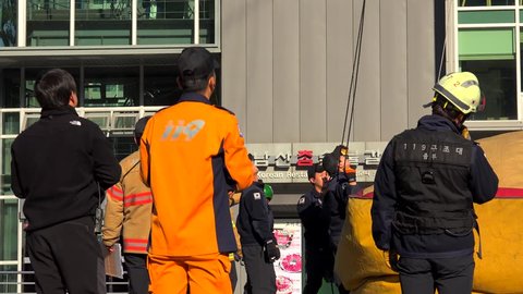 SEOUL, - OCTOBER 30, 2015:
Rescue Team (119) at the operation of saving people from the jammed cockpit of Namsan cable car. 
October 30, 2015 in Seoul, South Korea