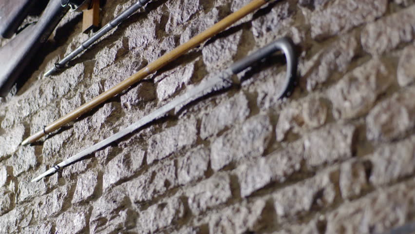 guns lined up horizontal on Marble wall