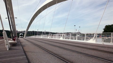 LYON, FRANCE - MAY, 2015 : Passage of the tramway on the bridge Raymond Barre