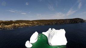 First iceberg to appear in the St. John's area of Canada in the spring. Calm day, clear sky and magnificent view of the iceberg from the air.