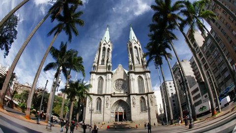 SAO PAULO, BRAZIL - JUNE 20: People walk in front of Catedral Da Se, the Roman Catholic Archdiocese of Sao Paulo Brazil June 20 2011. Catedral Da Se is considered the 4th largest neo-gothic cathedral in the world.