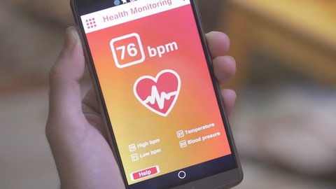 Monitoring the heart pulse with a health application on smartphone.