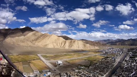 Timelapse of ancient Tingri town from Shegar Dzong (Chode Monastery) and field in Tibet, China
