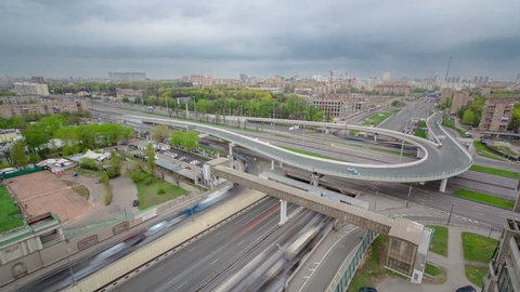 Top view of urban transport traffic on Leningradskoye shosse with overpass to begovaya timelapse. Leningradskoye Highway is a part of M10 federal highway Moscow to Saint Petersburg inside Moscow