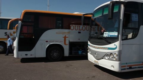 HURGHADA, EGYPT - CIRCA NOV, 2015: Line from the passenger buses for Russian tourists local transfer to hotels is in the Hurghada International airport