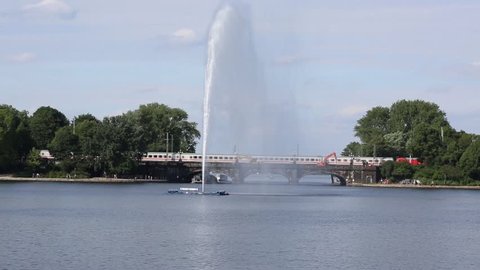 View of Alster lake, Hamburg, Germany, Fountain with a rainbow 