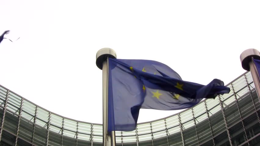 European Union flags outside the facade of the EU commission and seat of the European Parliament in the Belgian capital Brussels Royalty-Free Stock Footage #12993869
