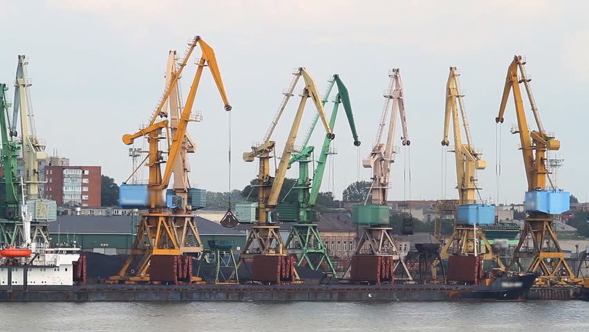 working cranes at port