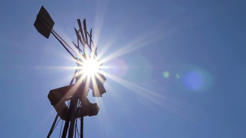 Farm windmill with sun
